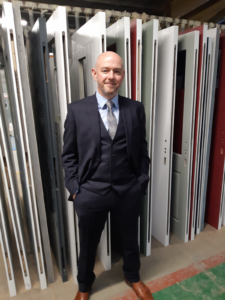 close up shot of manager in suit in front of door selection